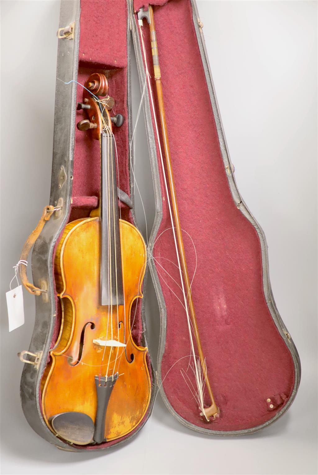 A late 19th century violin and a bow, cased